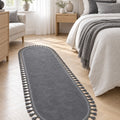 Puffy Geometric Boho Oval Rug – Charcoal in a bedroom