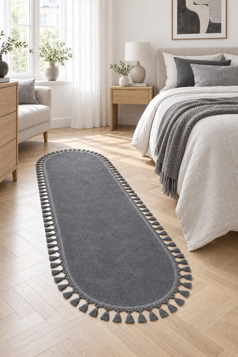 Puffy Geometric Boho Oval Rug – Charcoal in a bedroom