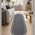 Puffy Geometric Boho Oval Rug – Charcoal in a living room