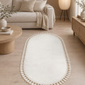 Puffy Geometric Boho Oval Rug – White in a living room
