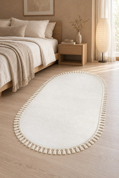 Puffy Geometric Boho Oval Rug – White in a bedroom