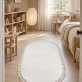 Puffy Geometric Boho Oval Rug – White in a nursery