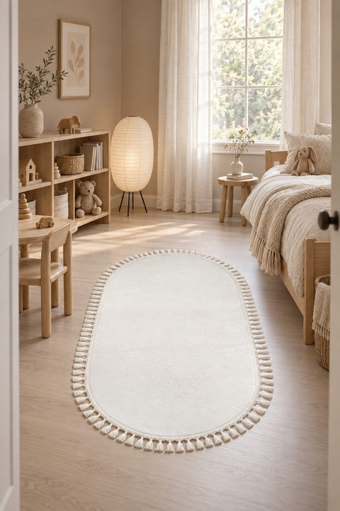 Puffy Geometric Boho Oval Rug – White in a nursery