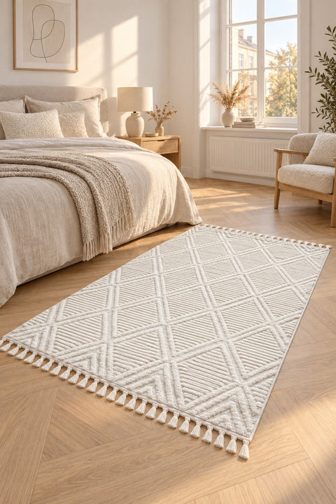 Quincey Modern Shag Area Rug – Cream in a bedroom