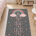 Rainbow Hopscotch Kids Area Rug in a nursery
