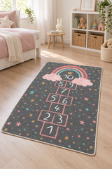 Rainbow Hopscotch Kids Area Rug in a nursery
