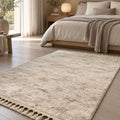 Raised Abstract Modern Area Rug – Beige in a bedroom