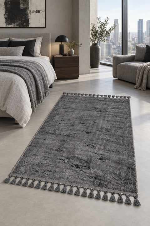 Raised Abstract Modern Area Rug – Charcoal in a bedroom