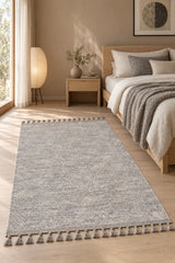 Raised Abstract Modern Area Rug – Gray in a bedroom