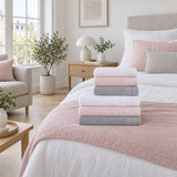 Solid Cotton Bath Towel Set of 6 in a bedroom