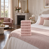 Solid Cotton Hand Towel Set of 6 – Blush in a bedroom