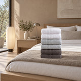 Solid Cotton Hand Towel Set of 6 – Charcoal, Gray & White in a bedroom