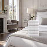 Solid Cotton Hand Towel Set of 6 – White in a bedroom