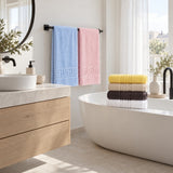 Solid Cotton Hand Towel Set of 6 – White, Cream, Charcoal, Blush, Blue in a bathroom