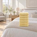 Solid Cotton Hand Towel Set of 6 – Yellow in a bedroom