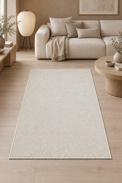 Solid Modern Area Rug – Cream in a living room