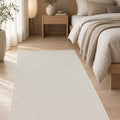Solid Modern Area Rug – Cream in a bedroom