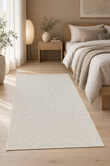 Solid Modern Area Rug – Cream in a bedroom