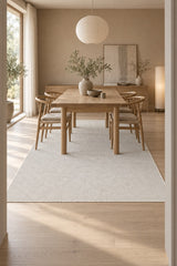 Solid Modern Area Rug – Cream in a dining room