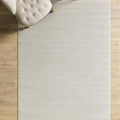 Solid Modern Area Rug – Cream in a living room