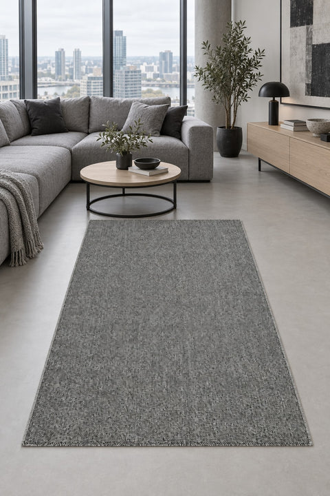 Solid Modern Area Rug – Gray in a living room