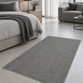 Solid Modern Area Rug – Gray in a bedroom