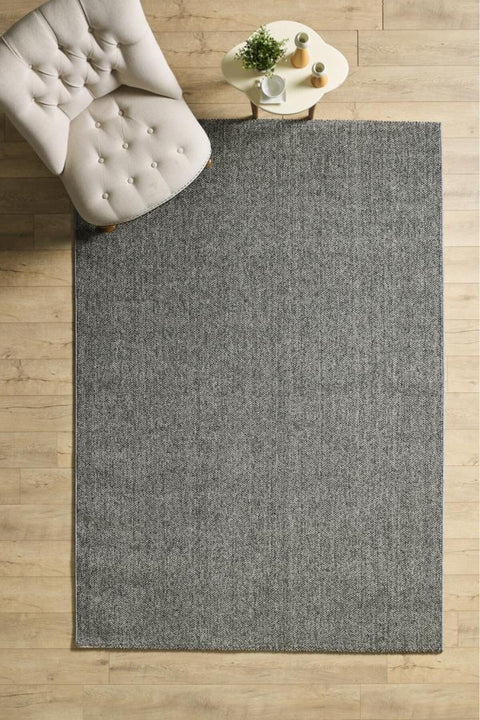 Solid Modern Area Rug – Gray in a living room