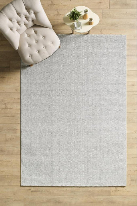 Solid Modern Area Rug – Light Gray in a living room