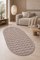 Solid Modern Oval Shag Rug – Brown in a living room