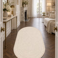 Solid Modern Oval Shag Rug – Brown in a hallway