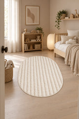 Solid Modern Oval Shag Rug – Cream in a nursery