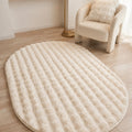 Solid Modern Oval Shag Rug – Cream in a living room