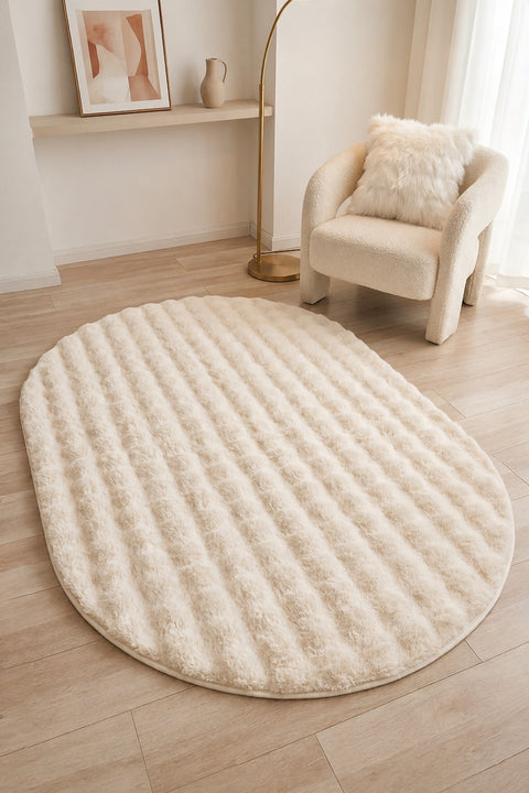 Solid Modern Oval Shag Rug – Cream in a living room