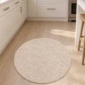 Solid Modern Round Plush Rug – Beige in a kitchen