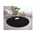 Solid Modern Round Plush Rug – Black in a living room