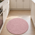 Solid Modern Round Plush Rug – Blush in a kitchen