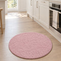 Solid Modern Round Plush Rug – Blush in a kitchen
