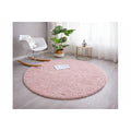 Solid Modern Round Plush Rug – Blush in a living room