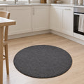 Solid Modern Round Plush Rug – Charcoal in a kitchen
