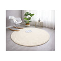 Solid Modern Round Plush Rug – Ecru in a living room