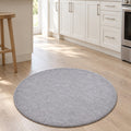Solid Modern Round Plush Rug – Gray in a kitchen