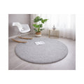 Solid Modern Round Plush Rug – Gray in a living room