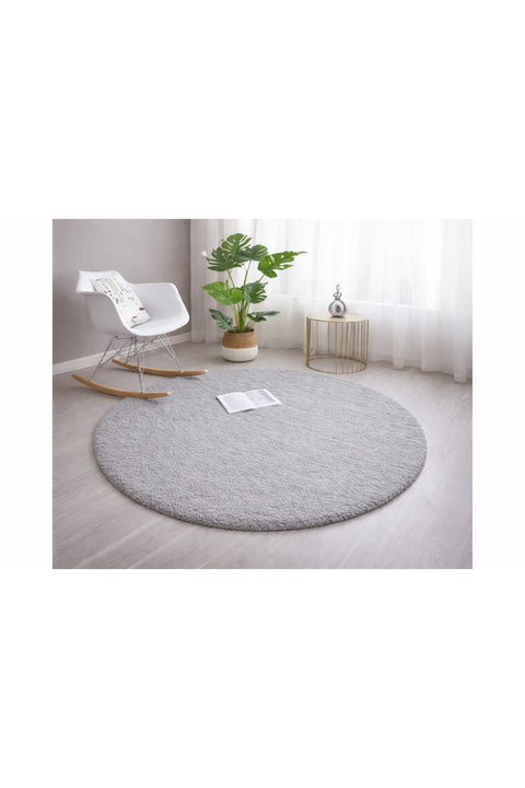 Solid Modern Round Plush Rug – Gray in a living room