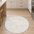 Solid Modern Round Plush Rug – White in a kitchen