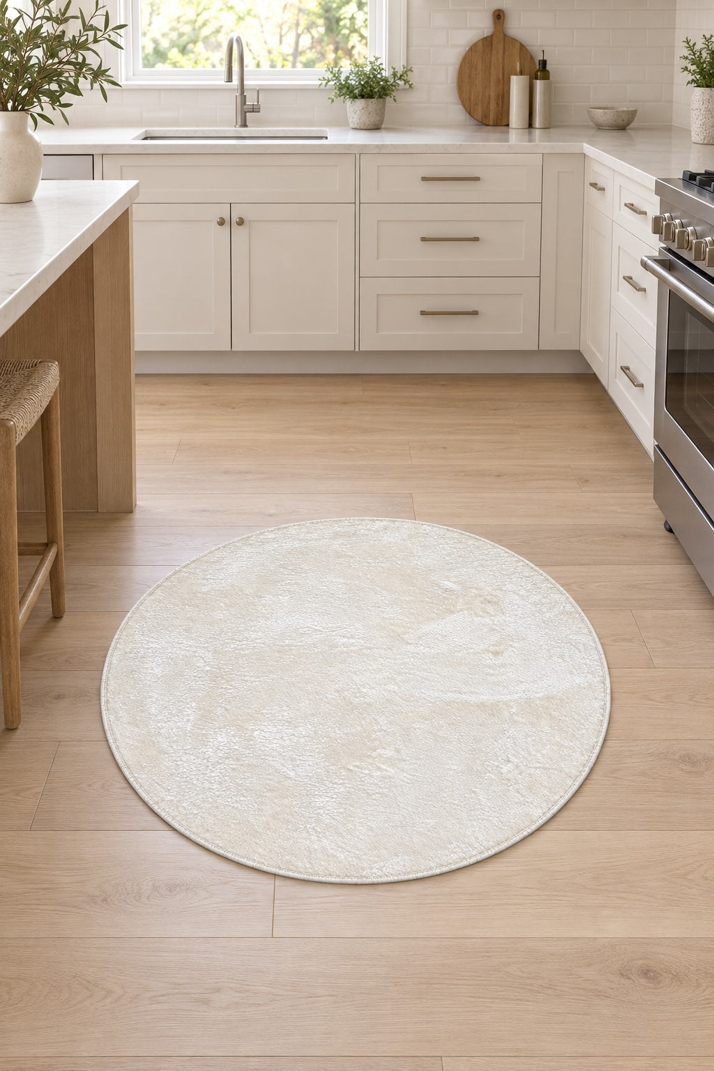 Solid Modern Round Plush Rug – White in a kitchen
