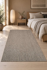 Striped Boho Kilim Area Rug – Gray in a bedroom