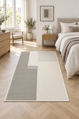 Striped Modern Area Rug – Gray in a bedroom