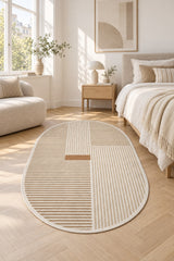 Striped Modern Oval Rug – Beige in a bedroom