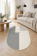 Striped Modern Oval Rug – Gray in a living room