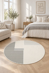 Striped Modern Round Area Rug – Gray in a bedroom